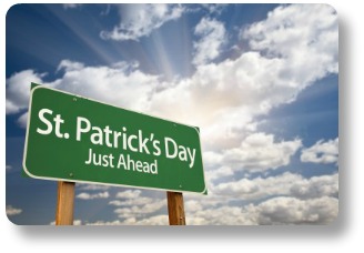 Green roadsign against a partly cloudy sky: St Patrick's Day Just Ahead.